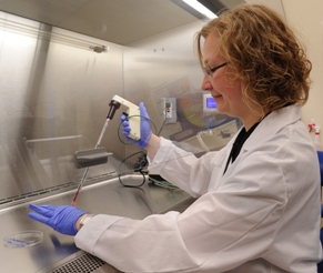 A doctor does research in a lab.